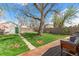 Enjoy this backyard space with mature trees, a wooden deck, and a lush lawn at 4120 S Lincoln S St, Englewood, CO 80113