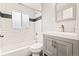 Modern bathroom featuring white subway tile and a stylish gray vanity at 4120 S Lincoln S St, Englewood, CO 80113
