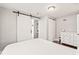 Bedroom with a sliding door, dresser, and hardwood floors at 4120 S Lincoln S St, Englewood, CO 80113