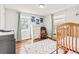 This cute bedroom with hardwood floors features two windows providing great natural light at 4120 S Lincoln S St, Englewood, CO 80113