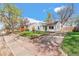 Street view of charming single-story home with driveway and manicured front yard at 4120 S Lincoln S St, Englewood, CO 80113
