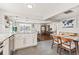 Open-concept kitchen with stainless steel appliances and connection to dining and living areas at 4120 S Lincoln S St, Englewood, CO 80113