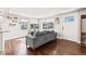 Bright living room featuring hardwood floors, and a comfortable gray couch at 4120 S Lincoln S St, Englewood, CO 80113