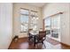 Bright dining room with a stylish light fixture and sliding door to the backyard at 14434 W 88Th Dr # B, Arvada, CO 80005