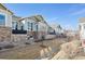 A row of townhomes with stone accents and large windows create an inviting and modern facade at 14434 W 88Th Dr # B, Arvada, CO 80005