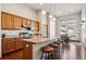 Modern kitchen featuring a large kitchen island, granite countertops and stainless steel appliances at 14434 W 88Th Dr # B, Arvada, CO 80005