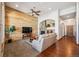 Comfortable living room features a stone fireplace and wood accent wall at 14434 W 88Th Dr # B, Arvada, CO 80005