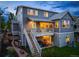 Backyard featuring a manicured lawn, garden, seating area, second story deck and walk out basement at 4738 Colorado River Dr, Firestone, CO 80504