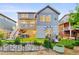 Backyard with a seating area, beautiful landscaping, retaining wall, and exterior of the home at 4738 Colorado River Dr, Firestone, CO 80504