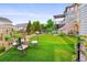 Backyard showing a well-manicured lawn, seating area, privacy fence, and exterior of the home at 4738 Colorado River Dr, Firestone, CO 80504