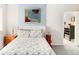 Serene bedroom featuring a comfortable bed, and a calming blue accent wall with stylish decor at 4738 Colorado River Dr, Firestone, CO 80504