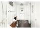 Bright entryway with a coat rack, decorative rug, and white walls, creating a welcoming space at 4738 Colorado River Dr, Firestone, CO 80504