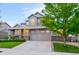 Beautiful two-story home with a two-car garage, landscaped yard, and welcoming curb appeal at 4738 Colorado River Dr, Firestone, CO 80504