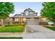 Attractive two-story home featuring a well-manicured lawn, two-car garage and stylish exterior at 4738 Colorado River Dr, Firestone, CO 80504