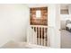 Hallway features a wood accent wall, white railings, and leads into a bedroom at 4738 Colorado River Dr, Firestone, CO 80504