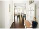 Hallway with wood floors leading to open-concept living spaces and a coat rack at 4738 Colorado River Dr, Firestone, CO 80504