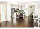 Spacious kitchen with an island, stainless steel appliances, and hardwood floors at 4738 Colorado River Dr, Firestone, CO 80504