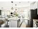Modern kitchen with an island, granite countertops and stainless steel appliances at 4738 Colorado River Dr, Firestone, CO 80504