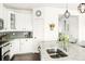Modern kitchen with granite countertops, stainless appliances, and glass cabinet displays at 4738 Colorado River Dr, Firestone, CO 80504