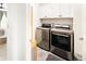 Modern laundry room with stainless steel appliances and ample cabinet space at 4738 Colorado River Dr, Firestone, CO 80504