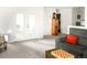 Inviting living area with french doors, a vintage chest, and a comfortable sofa with a colorful pillow at 4738 Colorado River Dr, Firestone, CO 80504