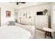 Well-lit main bedroom with light carpet, decorative accents, and large dresser at 4738 Colorado River Dr, Firestone, CO 80504