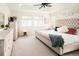 Well-lit main bedroom featuring neutral tones, soft carpet, and decorative accents at 4738 Colorado River Dr, Firestone, CO 80504