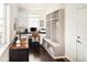 Office with hardwood floors, built-in shelving, and natural lighting at 4738 Colorado River Dr, Firestone, CO 80504