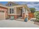 Charming front porch with brick accents and well-kept landscaping at 20058 E Dartmouth Dr, Aurora, CO 80013