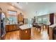 Bright eat-in kitchen with granite counters, stainless appliances, and hardwood floors at 20058 E Dartmouth Dr, Aurora, CO 80013