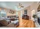 Comfortable living room featuring hardwood floors, a ceiling fan and a view to front door at 20058 E Dartmouth Dr, Aurora, CO 80013