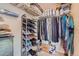 Walk-in closet with shelving, shoe racks, and hanging storage for optimal organization at 20058 E Dartmouth Dr, Aurora, CO 80013