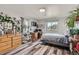 A plant-filled room with multiple windows giving a view to the outdoors at 16521 E 121St Cir Dr, Brighton, CO 80603