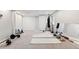 Spacious basement gym featuring exercise equipment, yoga mats and mirrored wall at 20740 Parker Vista Rd, Parker, CO 80138