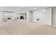 Spacious basement featuring a projector screen, seating area, computer area, and a dedicated workout space at 20740 Parker Vista Rd, Parker, CO 80138