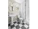 Cozy bathroom features pedestal sink, tiled floor, and shower with elegant white curtains at 20740 Parker Vista Rd, Parker, CO 80138