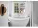 Bathroom showcasing a modern soaking tub with backyard views, perfect for relaxation at 20740 Parker Vista Rd, Parker, CO 80138