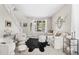 Bright living room features a modern design with a plush sofa, statement rug, and ample natural light from a large window at 20740 Parker Vista Rd, Parker, CO 80138