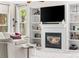 Cozy living room showcases a fireplace, built-in shelves, and comfortable seating for relaxation and entertainment at 20740 Parker Vista Rd, Parker, CO 80138
