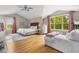 Spacious main bedroom with hardwood floors, vaulted ceilings, and plenty of natural light at 20740 Parker Vista Rd, Parker, CO 80138