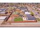 Aerial view of the backyard showing the lawn, storage sheds, and patio area at 5000 W Dakota Ave, Denver, CO 80219