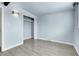 Spacious bedroom features closet, carpet and bright natural light at 5000 W Dakota Ave, Denver, CO 80219
