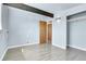 Bedroom with wood floors, a closet, and wood beam at 5000 W Dakota Ave, Denver, CO 80219