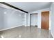 Charming bedroom with wood floors, closet, wood beam, and bright natural light at 5000 W Dakota Ave, Denver, CO 80219