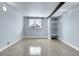 Bedroom with wood floors, a window and bright natural light at 5000 W Dakota Ave, Denver, CO 80219