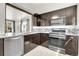 Well-appointed kitchen featuring granite counters, stainless appliances, and modern finishes at 5000 W Dakota Ave, Denver, CO 80219