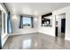 Open-concept living area boasts hardwood floors and an inviting view into the adjacent kitchen at 5000 W Dakota Ave, Denver, CO 80219