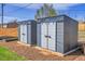 Backyard featuring two storage sheds at 5000 W Dakota Ave, Denver, CO 80219
