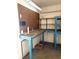 Spacious workshop area with pegboard, shelving, and workbench; perfect for hobbies and projects at 2986 W 119Th Ave, Westminster, CO 80234
