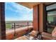 Relaxing balcony featuring comfortable seating, a brick facade and an incredible scenic view of the city at 8100 E Union Ave # 1502, Denver, CO 80237